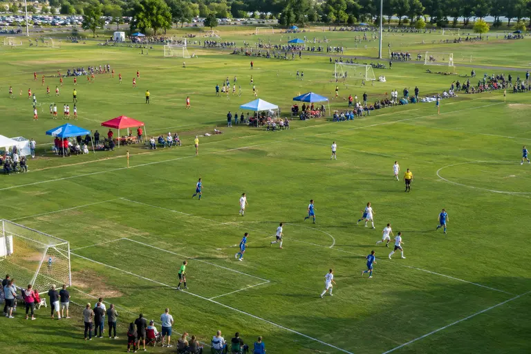 Families and players gathered near soccer fields before youth matches